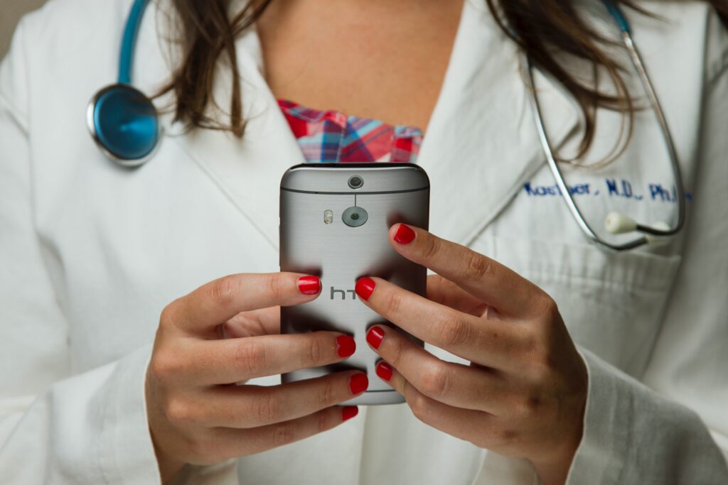 Doctor holding smart phone
